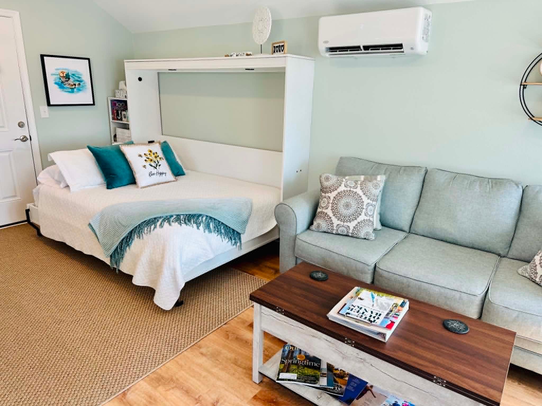 Cozy studio apartment with bed and sofa