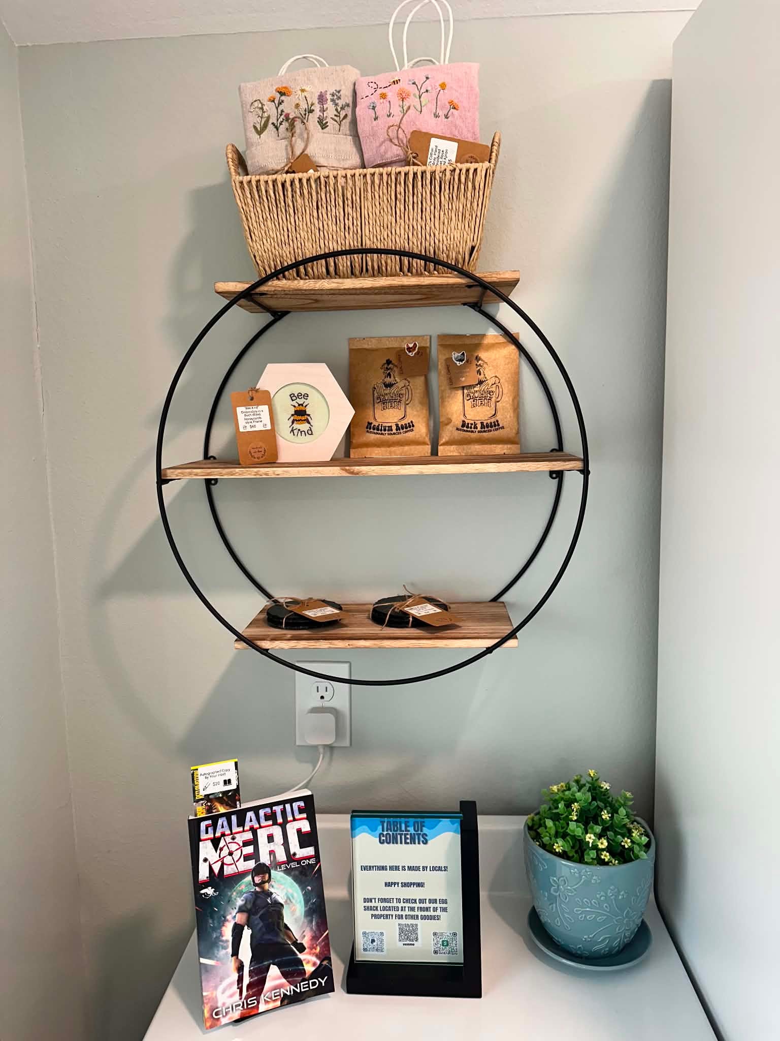 Shop local shelf with handmade goods, coffee, and visitor information